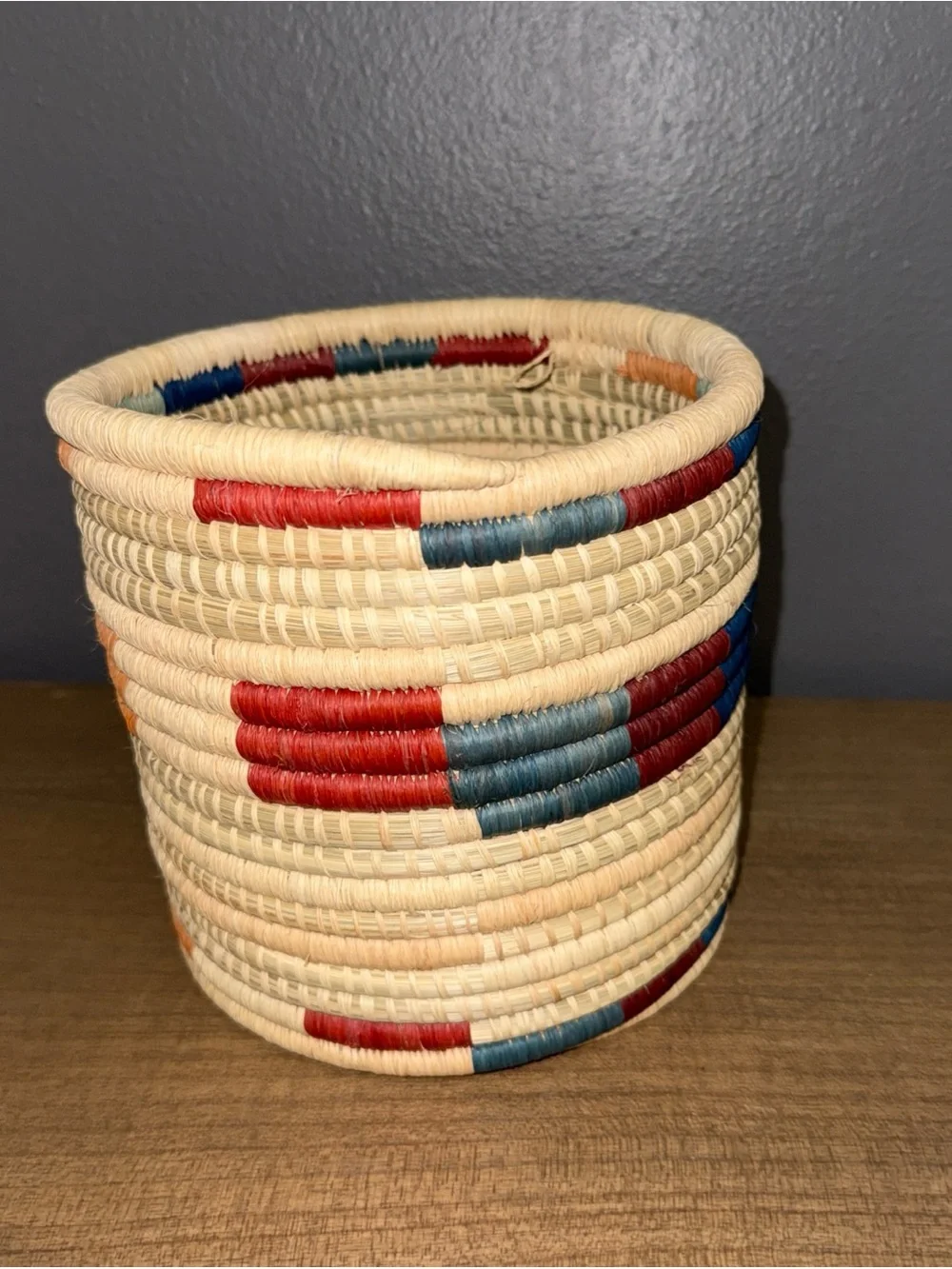 Handwoven Natural Basket with Red and Blue Accents